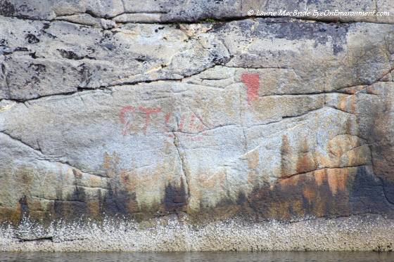 Faded pictograph and natural colours of the rock