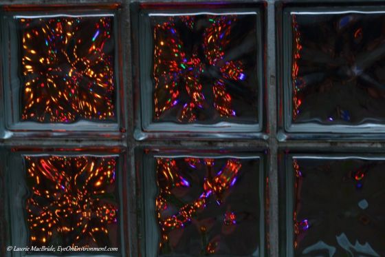 Christmas lights through a glass wall