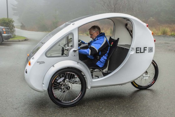 Man riding enclosed tricycle