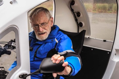 Man adjusting side mirror