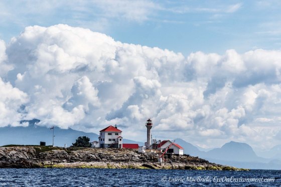 Entrance Island light station with cloud bank over the mountains beyond