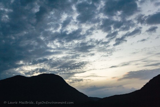 Clouds over mountain in evening sky